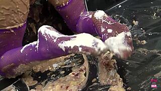 Picture two busty brunettes smearing food over tits and asses while kissing passionately