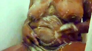 ebony mommy yuki-senpai fingers wet pussy to massive climax in steamy bathtub sneak