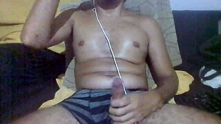 Brazilian amateur jerks huge cock in bedroom with heavy dirty talk instructions