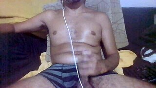 Brazilian amateur jerks huge cock in bedroom with heavy dirty talk instructions