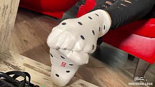 goddess teases wrinkled toes in socks then barefoot under desk close-up