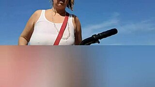 sunlit beach curves hint at mature blonde's hidden depths