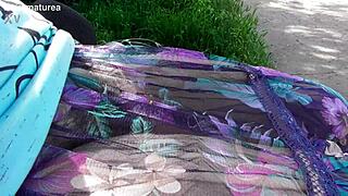 hairy mature flashes chubby pussy and fat body in see-through dress outdoors