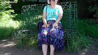 hairy mature flashes chubby pussy and fat body in see-through dress outdoors