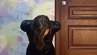Bound crossdresser in armbinder and gag awaits his rough fate.