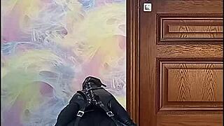 Bound crossdresser in armbinder and gag awaits his rough fate.