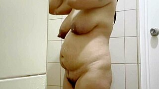 indian naughty step mom with big boobs and hairy pussy strips down in the steamy shower