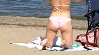 Pink princess hiding on beach, who's watching her candid moves?