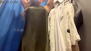i watch this milf's big boobs bounce as she tries sexy dresses in changing room
