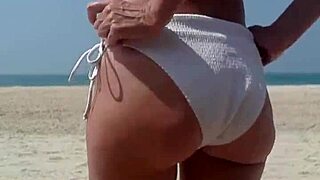 peeing in white bikini on public beach 😏 big ass fat girl outdoor