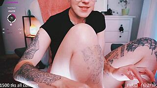 Cute short-haired tattooed girl with glasses indulges feet fetish on webcam using toys on wet pussy and big clit
