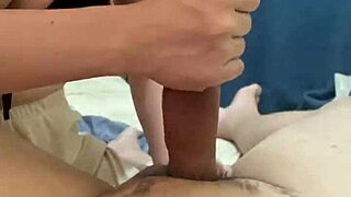 Girlfriend gives boyfriend quick handjob in dorm before work