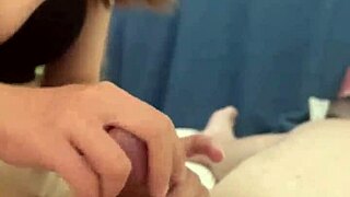 Girlfriend gives boyfriend quick handjob in dorm before work