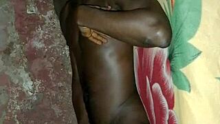 African man demonstrates solo masturbation skills on bed