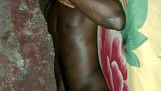 African man demonstrates solo masturbation skills on bed