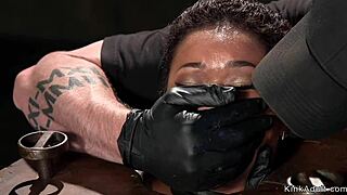 ugh small tits ebony slave gagged choked fingered hard in bondage device!!