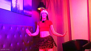 curvy brunette dances christmas song in tight miniskirt shaking small waist big tits