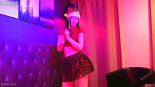 curvy brunette dances christmas song in tight miniskirt shaking small waist big tits