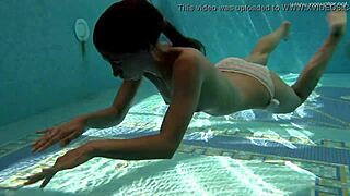 Petite Russian teen Irina Russaka dives into public underwater pool bath