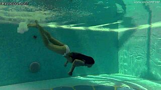 Petite Russian teen Irina Russaka dives into public underwater pool bath