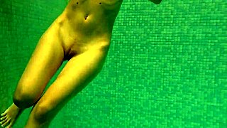 Petite Russian teen Irina Russaka dives into public underwater pool bath