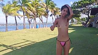 Skinny Latina flashes hairy pussy tits thong stripping bare public beach tease